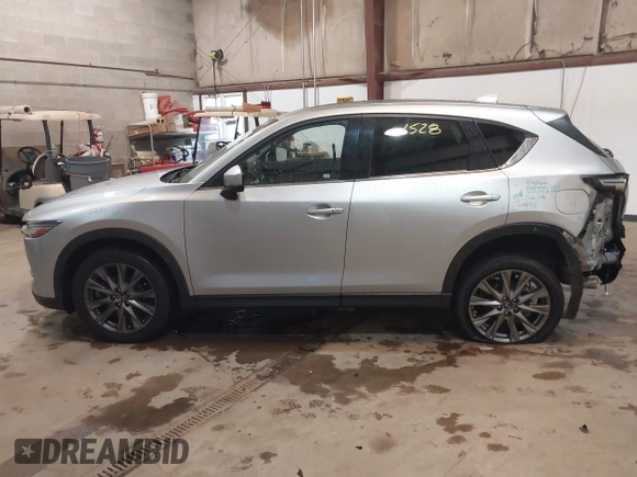 2021 Mazda CX-5 Grand Touring with VIN JM3KFADMXM1318015, listed as a IAAI auction lot 41221528 with 79,473 mi miles. Bid and sale history available at carsss.com. Image 14.