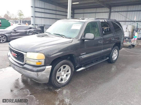 2005 GMC Yukon SLT with VIN 1GKEC13T75R144645, listed as a IAAI auction lot 41703999 with 222,585 mi miles. Bid and sale history available at carsss.com. Image 2.