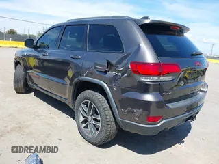 2017 Jeep Grand Cherokee Trailhawk with VIN 1C4RJFLG3HC877110, listed as a IAAI auction lot 42276506 with 144,993 mi miles and . Bid and sale history available at DreamBid. Image 3.