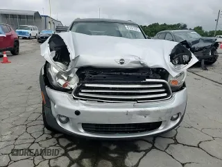 2012 MINI Countryman with VIN WMWZB3C5XCWM06778, listed as a Copart auction lot 61201285 with 64,676 mi miles and Salvage title. Bid and sale history available at DreamBid. Image 13.