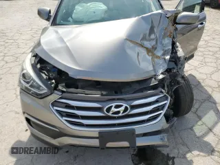 2018 Hyundai Santa Fe 2.4L z VIN 5NMZTDLB9JH079656, wystawiony jako Copart lot #54256175 z przebiegiem 100 678 mil mil oraz Szkoda całkowita • Salvage title. Historia ofert i sprzedaży dostępna na DreamBid. Obrazek 12.