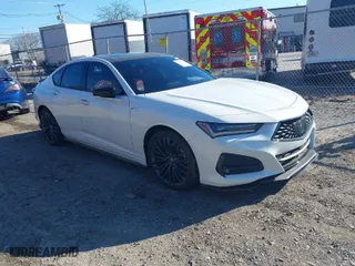 2022 Acura TLX w/A-Spec Package with VIN 19UUB5F52NA005022, listed as a IAAI auction lot 40977803 with 9,665 mi miles. Bid and sale history available at carsss.com. Image 1.