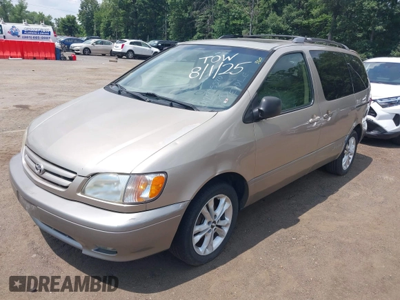 2001 Toyota Sienna LE with VIN 4T3ZF13C01U325889, listed as a IAAI auction lot 42795570 with 211,585 mi miles and . Bid and sale history available at DreamBid. Image 2.