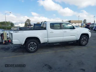 2020 Toyota Tacoma SR5 with VIN 3TMBZ5DN7LM026596, listed as a IAAI auction lot 40705410 with 123,489 mi miles and . Bid and sale history available at DreamBid. Image 14.