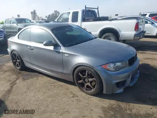 2009 BMW 1 Series 135i with VIN WBAUC73549VK80091, listed as a IAAI auction lot 41228611 with 128,515 mi miles. Bid and sale history available at carsss.com. Image 1.