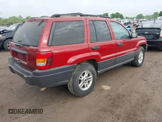 2004 Jeep Grand Cherokee Laredo with VIN 1J4GW48S64C371253, listed as a IAAI auction lot 42099607 with 260,618 mi miles. Bid and sale history available at carsss.com. Image 4.