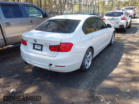 2014 BMW 3 Series 328i xDrive with VIN WBA3B3C55EJ979836, listed as a IAAI auction lot 41886624 with 140,684 mi miles. Bid and sale history available at carsss.com. Image 4.
