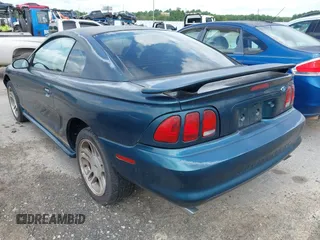 1996 Ford Mustang GT z VIN 1FALP42XXTF137304, wystawiony jako IAAI lot #42464808 z przebiegiem 166 565 mil mil oraz . Historia ofert i sprzedaży dostępna na DreamBid. Obrazek 3.