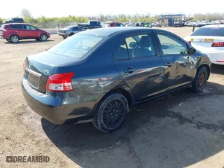 2009 Toyota Yaris with VIN JTDBT903194047784, listed as a IAAI auction lot 42049872 with 115,735 mi miles. Bid and sale history available at carsss.com. Image 4.
