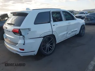 2018 Jeep Grand Cherokee Overland z VIN 1C4RJFCG7JC158464, wystawiony jako IAAI lot #42056386 z przebiegiem 94 608 mil mil oraz . Historia ofert i sprzedaży dostępna na DreamBid. Obrazek 6.