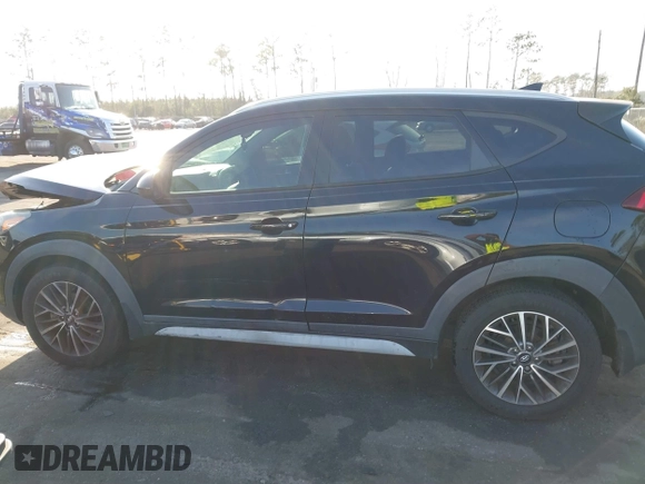2019 Hyundai Tucson Sport z VIN KM8J33AL9KU878474, wystawiony jako IAAI lot #41568959 z przebiegiem 97 412 mil mil oraz . Historia ofert i sprzedaży dostępna na DreamBid. Obrazek 14.