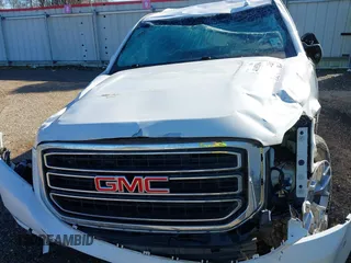 2019 GMC Yukon XL SLT with VIN 1GKS1GKC1KR335082, listed as a IAAI auction lot 41652504 with 135,824 mi miles. Bid and sale history available at carsss.com. Image 10.