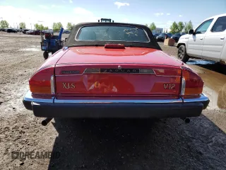 1989 Jaguar XJS z VIN SAJNL4841KC160063, wystawiony jako Copart lot #57462075 z przebiegiem 120 979 mil mil oraz Szkoda całkowita • Salvage title. Historia ofert i sprzedaży dostępna na DreamBid. Obrazek 6.
