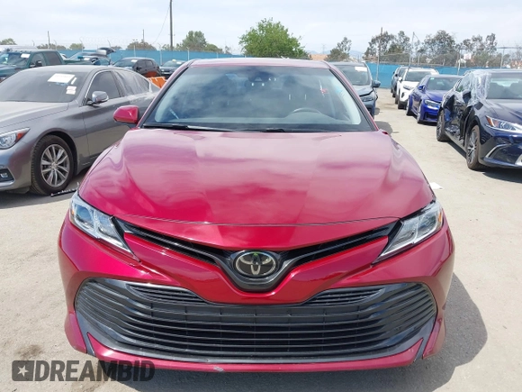 2020 Toyota Camry LE with VIN 4T1C11AK9LU991305, listed as a IAAI auction lot 41976371 with 57,422 mi miles and . Bid and sale history available at carsss.com. Image 12.