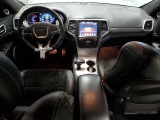 2015 Jeep Grand Cherokee SRT with VIN 1C4RJFDJ8FC752210, listed as a Copart auction lot 88773005 with 76,721 mi miles and Salvage Title. Bid and sale history available at carsss.com. Image 8.