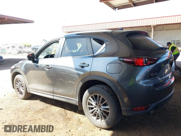 2021 Mazda CX-5 Touring with VIN JM3KFACM2M1313750, listed as a IAAI auction lot 41762938 with 68,503 mi miles. Bid and sale history available at carsss.com. Image 3.