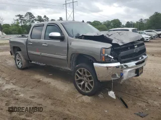 2013 Chevrolet Silverado 1500 LT with VIN 3GCPCSE07DG265705, listed as a Copart auction lot 51494245 with 127,731 mi miles and Salvage Title. Bid and sale history available at DreamBid. Image 4.
