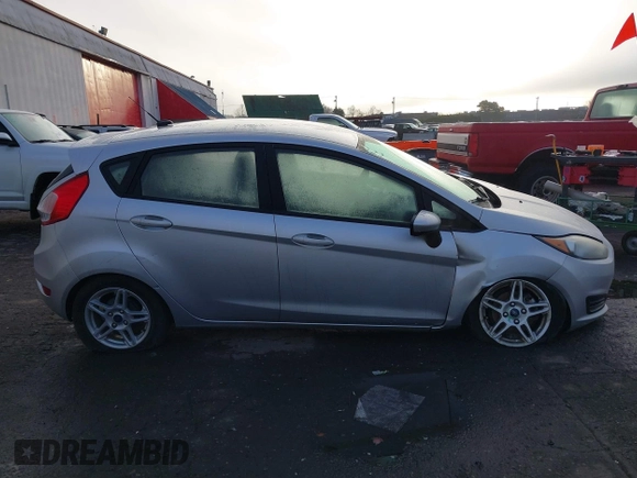 2019 Ford Fiesta SE z VIN 3FADP4EJ7KM147864, wystawiony jako IAAI lot #41692160 z przebiegiem 87 417 mil mil oraz . Historia ofert i sprzedaży dostępna na DreamBid. Obrazek 13.
