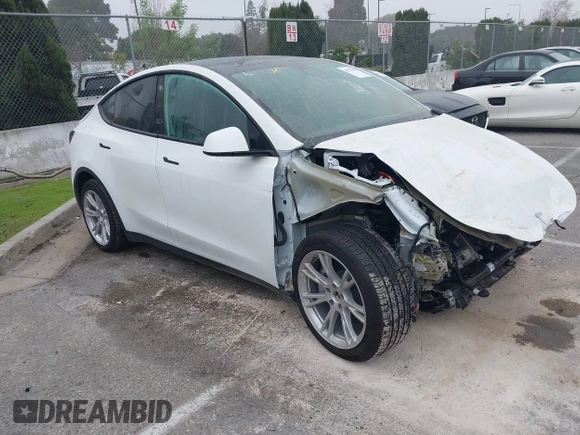 2022 Tesla Model Y Long Range z VIN 7SAYGDEE4NF315356, wystawiony jako IAAI lot #41571151 z przebiegiem 1 056 mil mil oraz . Historia ofert i sprzedaży dostępna na DreamBid. Obrazek 1.