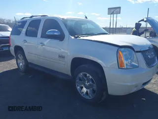 2014 GMC Yukon SLT with VIN 1GKS1CE01ER179379, listed as a IAAI auction lot 41717271 with 136,999 mi miles. Bid and sale history available at carsss.com. Image 1.