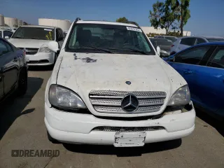 2000 Mercedes-Benz M-Class with VIN 4JGAB54E5YA165660, listed as a Copart auction lot 65872364 with 115,668 mi miles and Salvage Title. Bid and sale history available at carsss.com. Image 5.