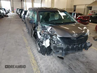 2015 Toyota Sienna L with VIN 5TDZK3DCXFS567507, listed as a IAAI auction lot 41205670 with 104,443 mi miles. Bid and sale history available at carsss.com. Image 1.