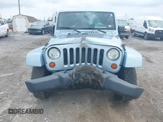 2012 Jeep Wrangler Arctic with VIN 1C4AJWBG7CL148325, listed as a IAAI auction lot 39943602 with 86,625 mi miles and . Bid and sale history available at DreamBid. Image 6.