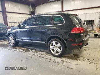 2011 Volkswagen Touareg Exec with VIN WVGFK9BP8BD003948, listed as a Copart auction lot 48285065 with 152,497 mi miles and Salvage Title. Bid and sale history available at DreamBid. Image 2.
