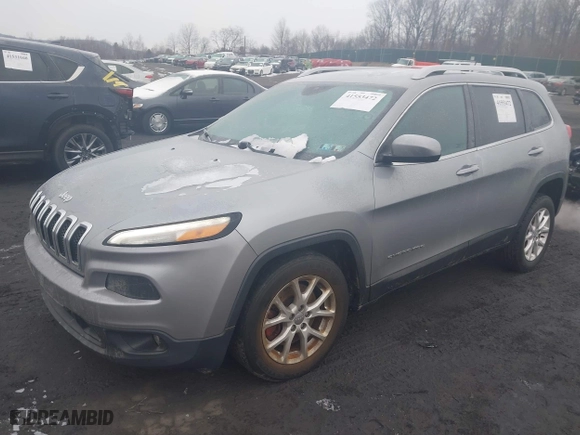2014 Jeep Cherokee Latitude with VIN 1C4PJLCBXEW299124, listed as a IAAI auction lot 41553472 with 151,893 mi miles. Bid and sale history available at carsss.com. Image 17.