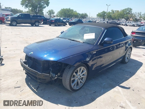 2013 BMW 1 Series 135i with VIN WBAUN7C57DVM28236, listed as a IAAI auction lot 41900116 with 38,876 mi miles and . Bid and sale history available at carsss.com. Image 2.