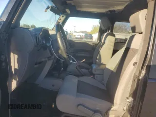 2010 Jeep Wrangler Rubicon with VIN 1J4BA6D10AL203265, listed as a Copart auction lot 79570754 with 114,840 mi miles and Salvage title. Bid and sale history available at DreamBid. Image 7.