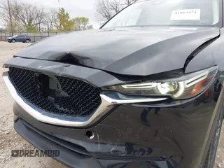 2018 Mazda CX-5 Grand Touring with VIN JM3KFBDM3J0384431, listed as a IAAI auction lot 42013474 with 65,018 mi miles. Bid and sale history available at carsss.com. Image 18.