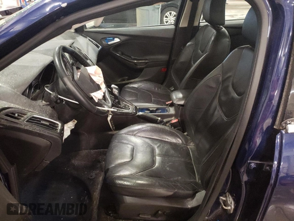 2016 Ford Focus Titanium z VIN 1FADP3J27GL310367, wystawiony jako Copart lot #55048005 z przebiegiem 86 676 mil mil oraz Szkoda całkowita • Salvage title. Historia ofert i sprzedaży dostępna na DreamBid. Obrazek 7.