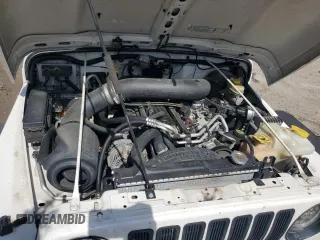 2003 Jeep Wrangler Rubicon z VIN 1J4FA69S73P333199, wystawiony jako Copart lot #50602615 z przebiegiem 133 254 mil mil oraz Szkoda całkowita • Salvage title. Historia ofert i sprzedaży dostępna na DreamBid. Obrazek 12.