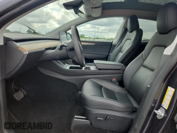 2024 Tesla Model Y Long Range with VIN 7SAYGDEE9RA255688, listed as a Copart auction lot 58918665 with 21,302 mi miles and Salvage title. Bid and sale history available at DreamBid. Image 7.