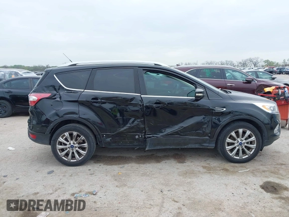 2017 Ford Escape Titanium with VIN 1FMCU0J93HUF10664, listed as a IAAI auction lot 41921588 with 88,377 mi miles. Bid and sale history available at carsss.com. Image 13.