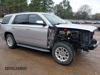 2015 GMC Yukon SLT with VIN 1GKS1BKC7FR628736, listed as a IAAI auction lot 41709926 with 130,254 mi miles. Bid and sale history available at carsss.com. Image 1.
