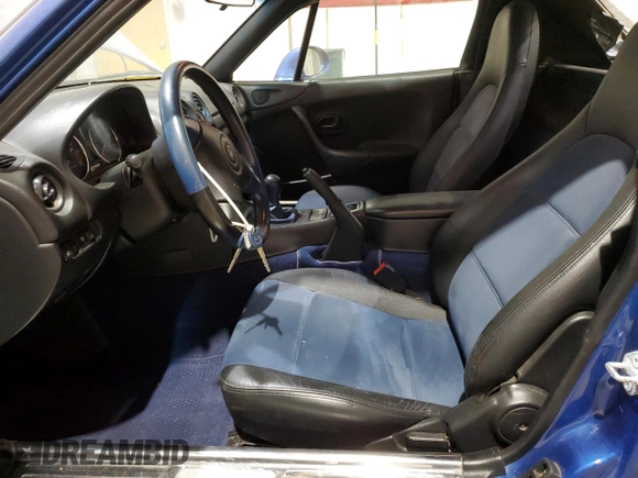 1999 Mazda MX-5 Miata with VIN JM1NB3532X0136645, listed as a Copart auction lot 59480265 with 160,936 mi miles and Clean title. Bid and sale history available at DreamBid. Image 7.
