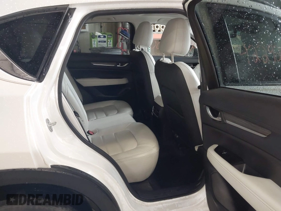 2020 Mazda CX-5 Grand Touring with VIN JM3KFADMXL0742038, listed as a IAAI auction lot 42292400 with 68,339 mi miles and . Bid and sale history available at DreamBid. Image 8.