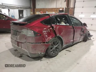 2023 Tesla Model X with VIN 7SAXCDE51PF403632, listed as a IAAI auction lot 41328722 with Not Provided miles and . Bid and sale history available at DreamBid. Image 4.