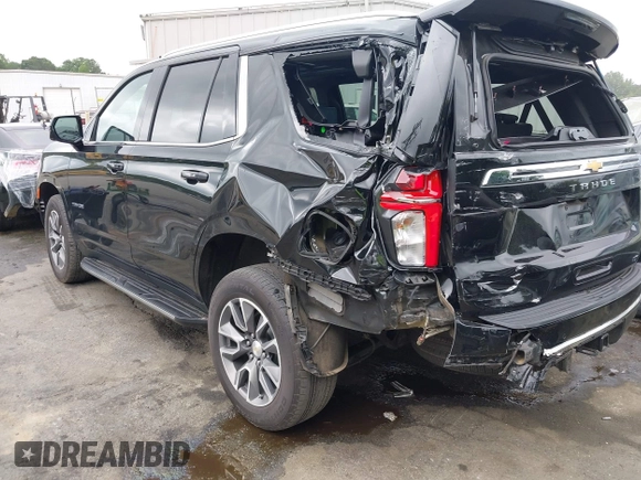 2023 Chevrolet Tahoe LT with VIN 1GNSKNKD8PR105849, listed as a IAAI auction lot 42308786 with 51,748 mi miles and . Bid and sale history available at DreamBid. Image 3.