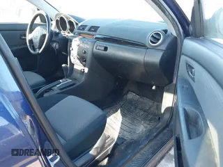 2006 Mazda 3 i with VIN JM1BK12F861468765, listed as a IAAI auction lot 41672325 with 247,918 mi miles. Bid and sale history available at carsss.com. Image 5.