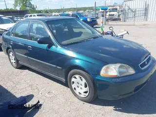 1997 Honda Civic LX with VIN JHMEJ6678VS032473, listed as a IAAI auction lot 42110249 with 257,328 mi miles. Bid and sale history available at carsss.com. Image 1.
