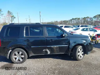 2013 Honda Pilot Touring with VIN 5FNYF4H9XDB047796, listed as a IAAI auction lot 41591189 with 188,579 mi miles and . Bid and sale history available at carsss.com. Image 12.