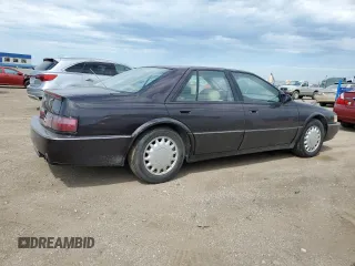 1992 Cadillac Seville z VIN 1G6KY53BXNU804126, wystawiony jako Copart lot #69219394 z przebiegiem 100 647 mil mil oraz Czysty tytuł • Clean title. Historia ofert i sprzedaży dostępna na DreamBid. Obrazek 3.