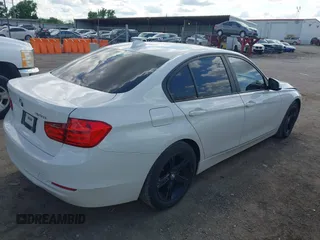 2014 BMW 3 Series 328i with VIN WBA3A5C5XEJ463938, listed as a IAAI auction lot 42103330 with 194,263 mi miles and . Bid and sale history available at DreamBid. Image 4.