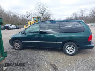 1999 Chrysler Town & Country with VIN 1C4GP54G6XB603564, listed as a IAAI auction lot 41823340 with 104,321 mi miles and . Bid and sale history available at DreamBid. Image 14.