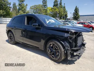 2024 BMW iX xDrive50 z VIN WB523CF05RCN96948, wystawiony jako Copart lot #50858304 z przebiegiem 8923 mil mil oraz Szkoda całkowita • Salvage title. Historia ofert i sprzedaży dostępna na DreamBid. Obrazek 4.