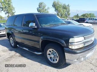 2003 Chevrolet Tahoe LS z VIN 1GNEC13V73R291212, wystawiony jako IAAI lot #42373833 z przebiegiem 113 412 mil mil oraz . Historia ofert i sprzedaży dostępna na DreamBid. Obrazek 1.