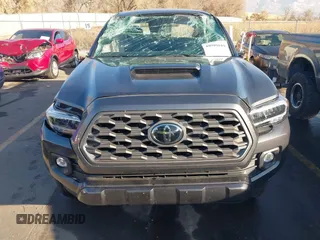 2023 Toyota Tacoma SR with VIN 3TMCZ5AN2PM553928, listed as a IAAI auction lot 40999044 with 9,210 mi miles and . Bid and sale history available at DreamBid. Image 12.